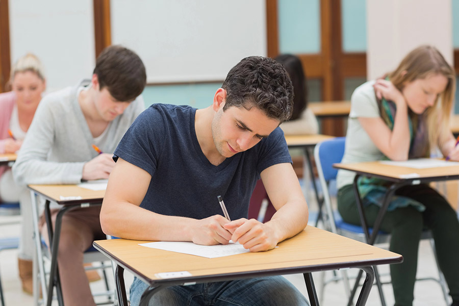 Students taking a test in a classroom in Huntington